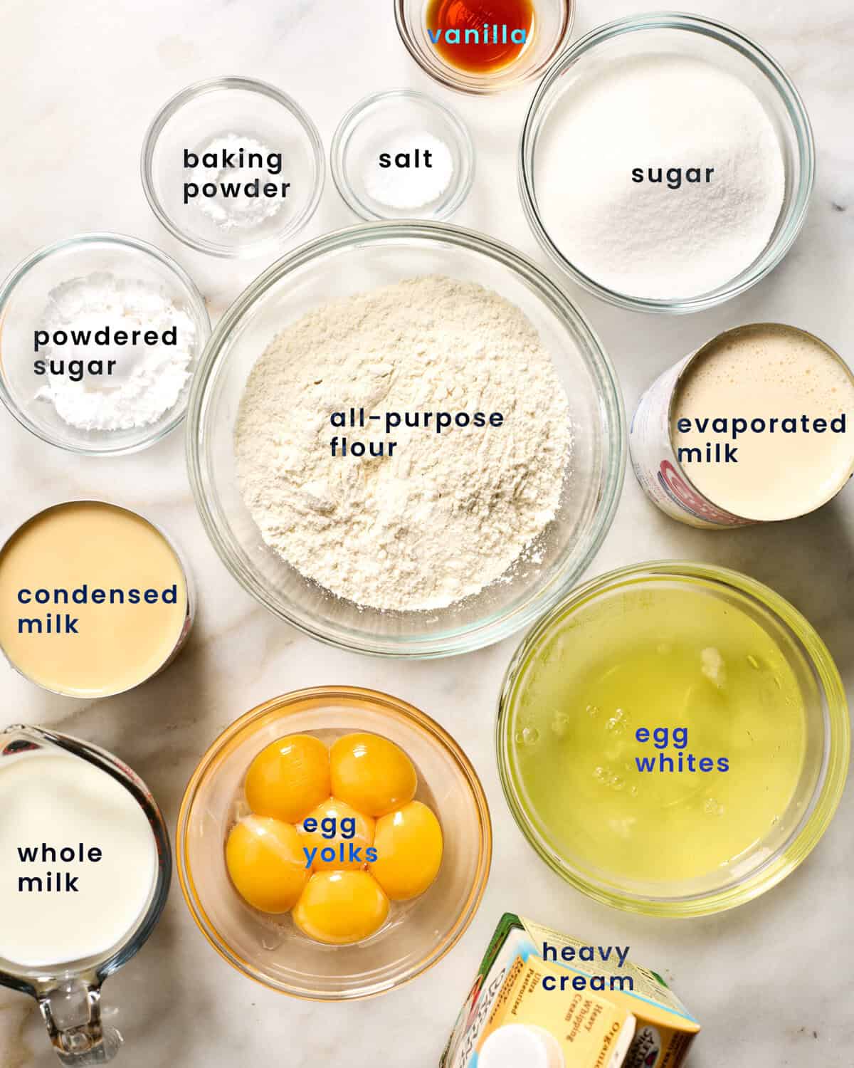 Ingredients for Tres Leches in small bowls.