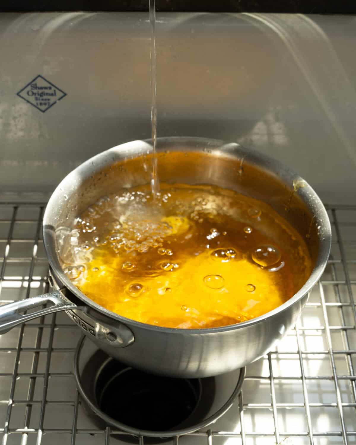 Pan being cleaned. 