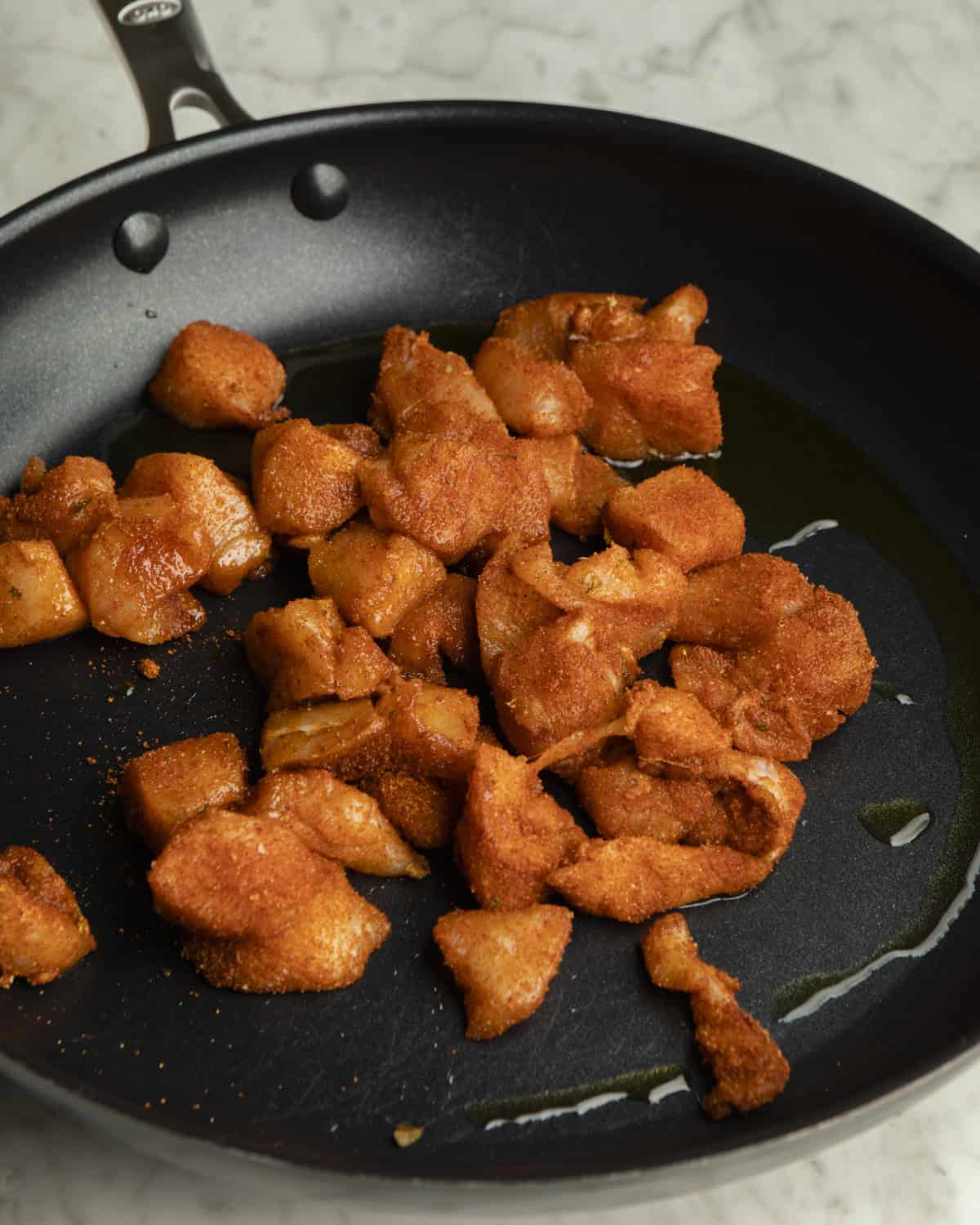 Raw chicken in pan. 
