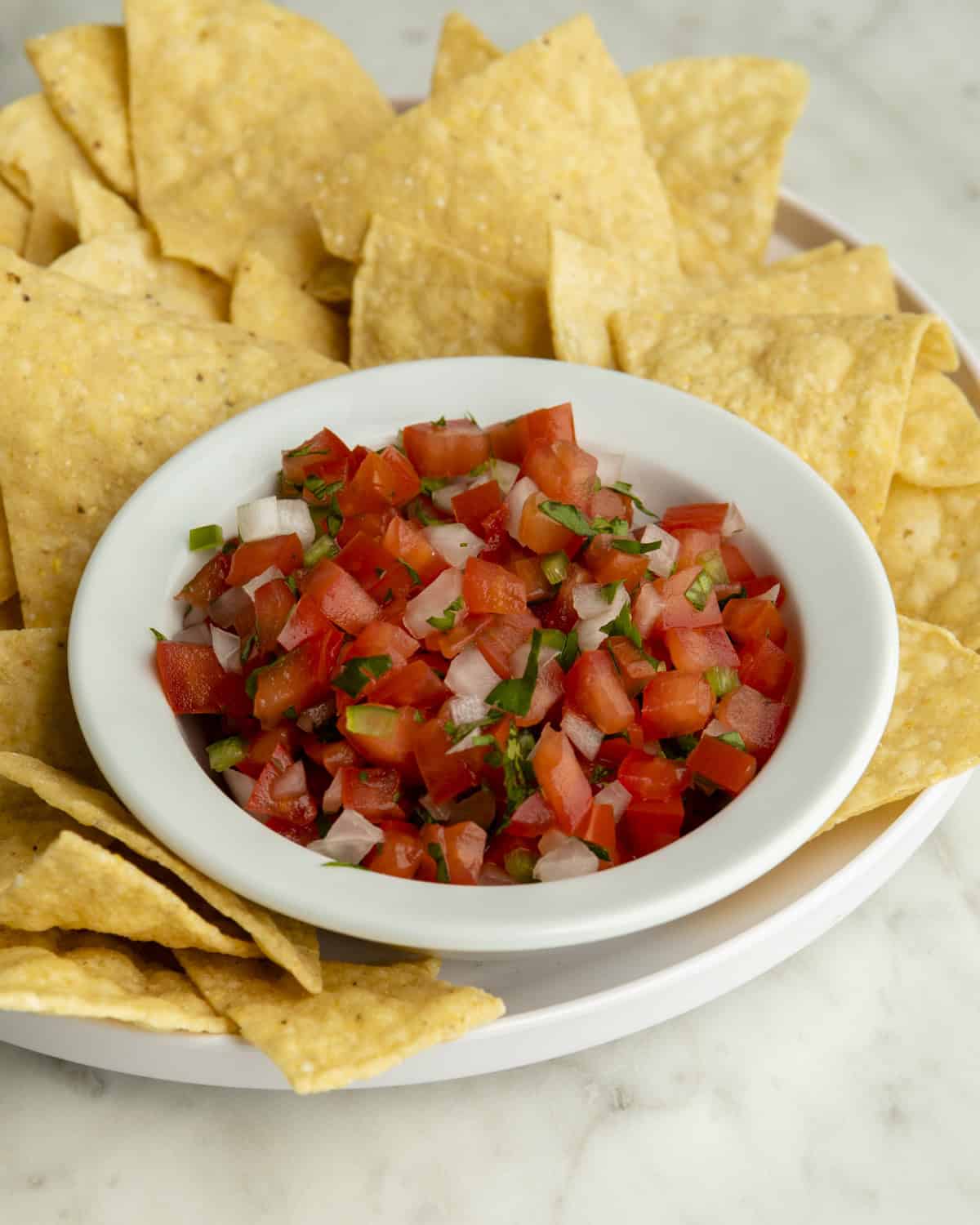 Pico de Gallo in bowl with chips. 
