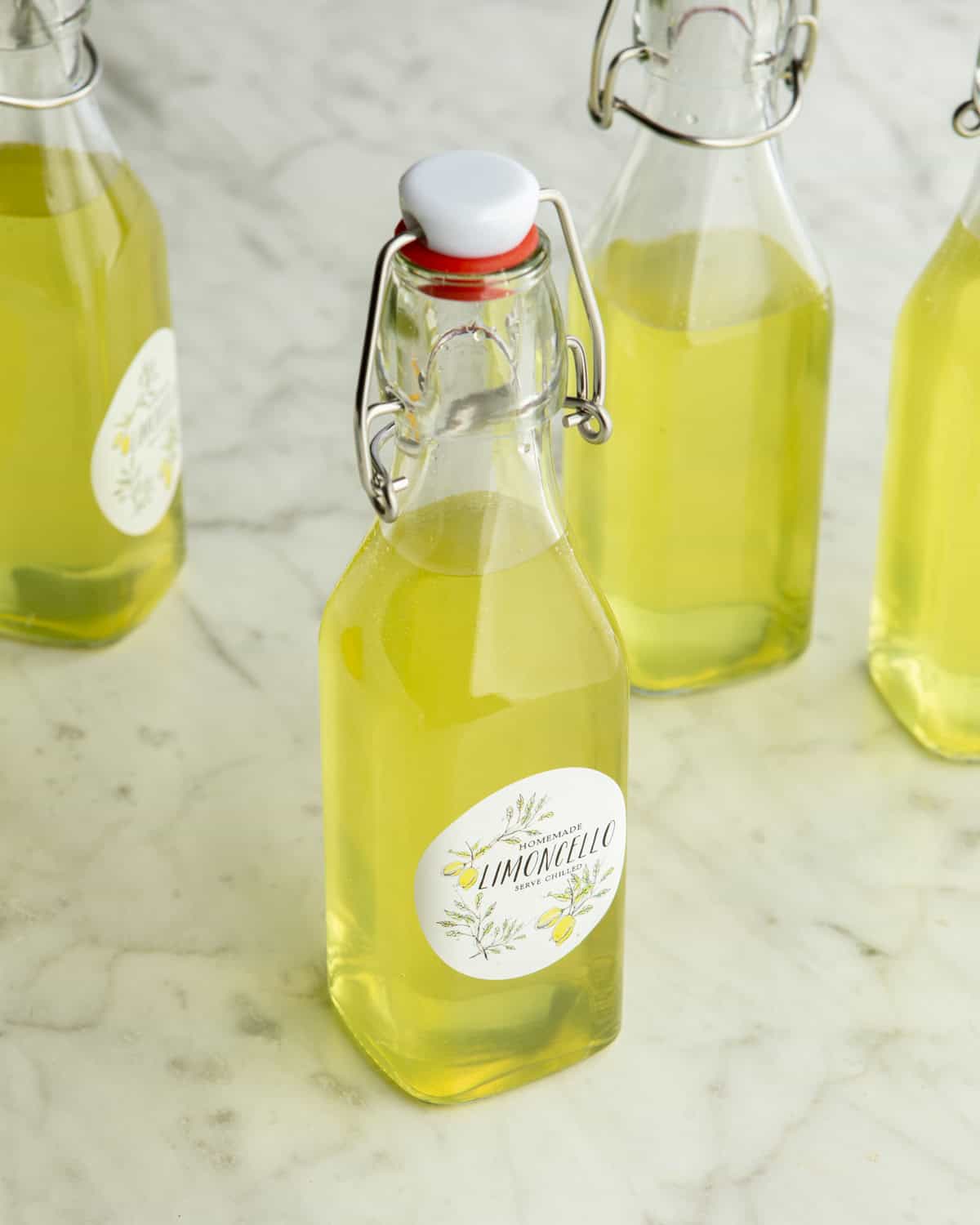 Homemade Limoncello bottles on a counter. 