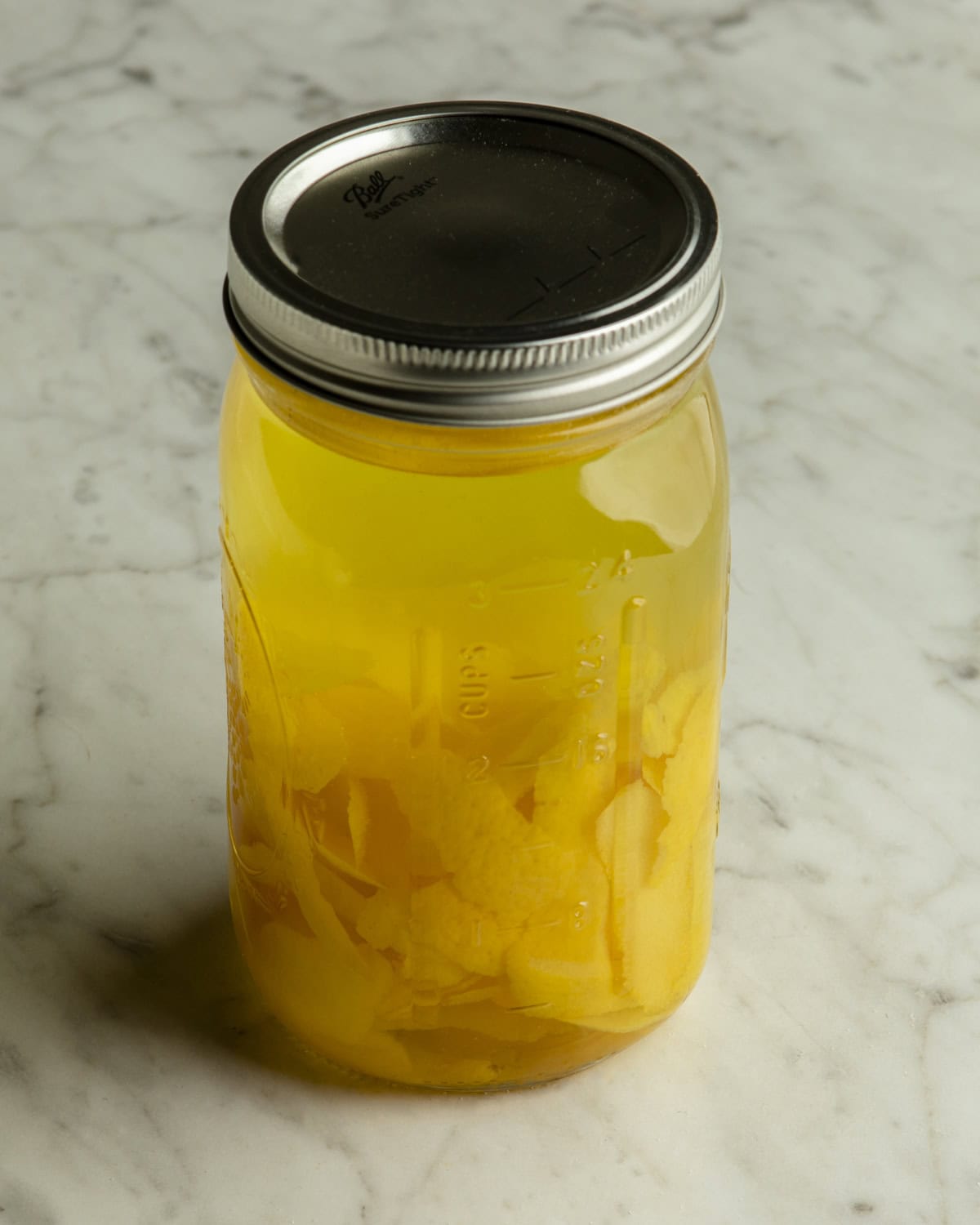 Lid on homemade limoncello. 