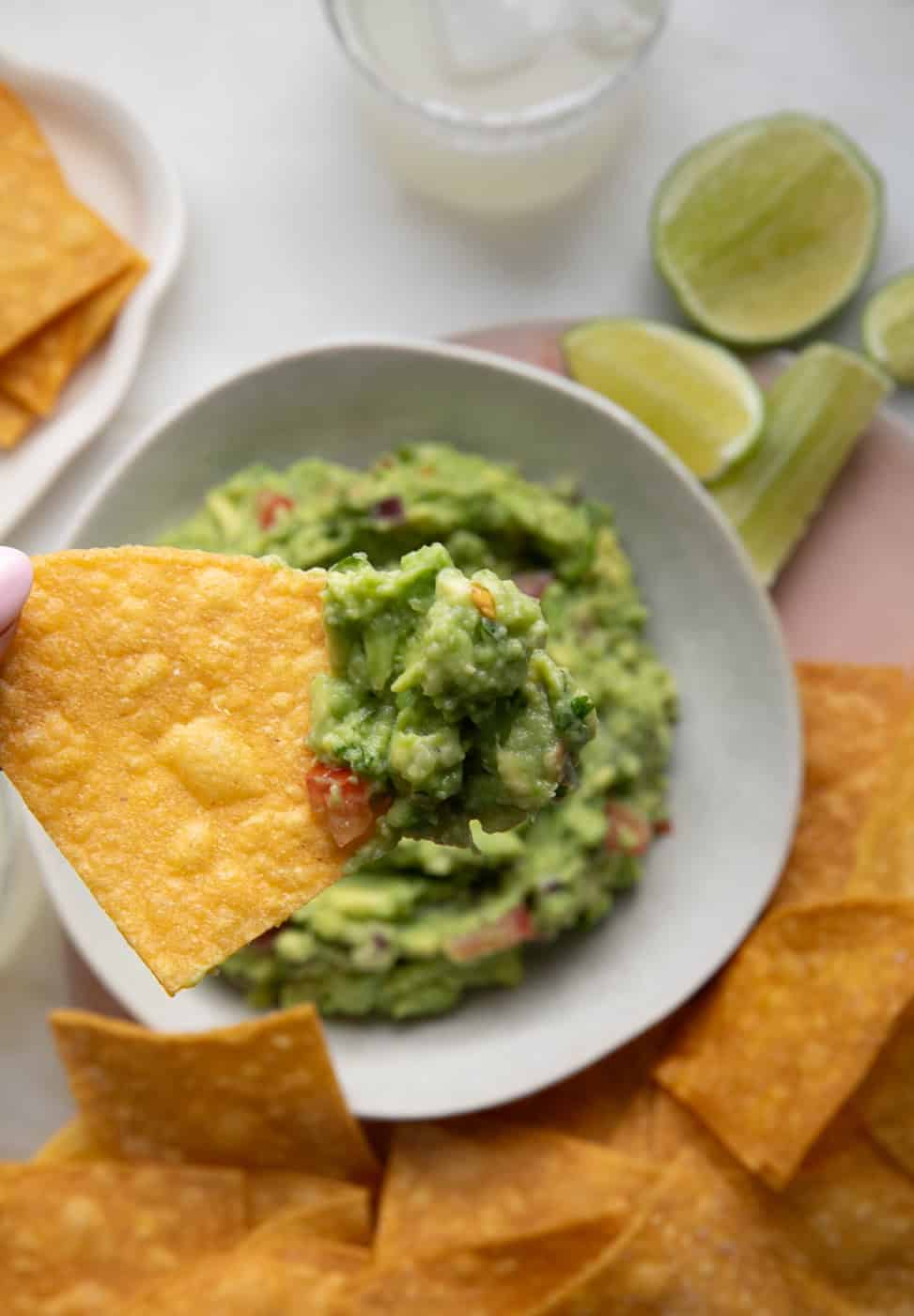 Homemade Tortilla Chip dipped in guacamole. 