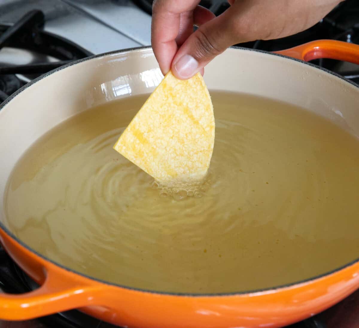 Tortilla dipped into hot oil. 
