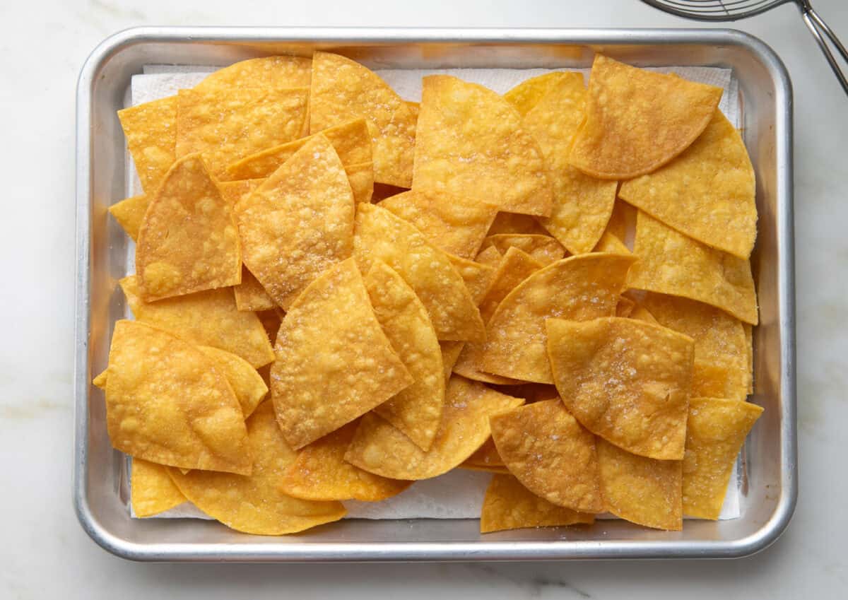 Homemade Tortilla Chips on a baking sheet. 