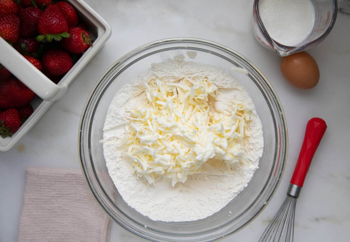 Butter grated in a large bowl. 