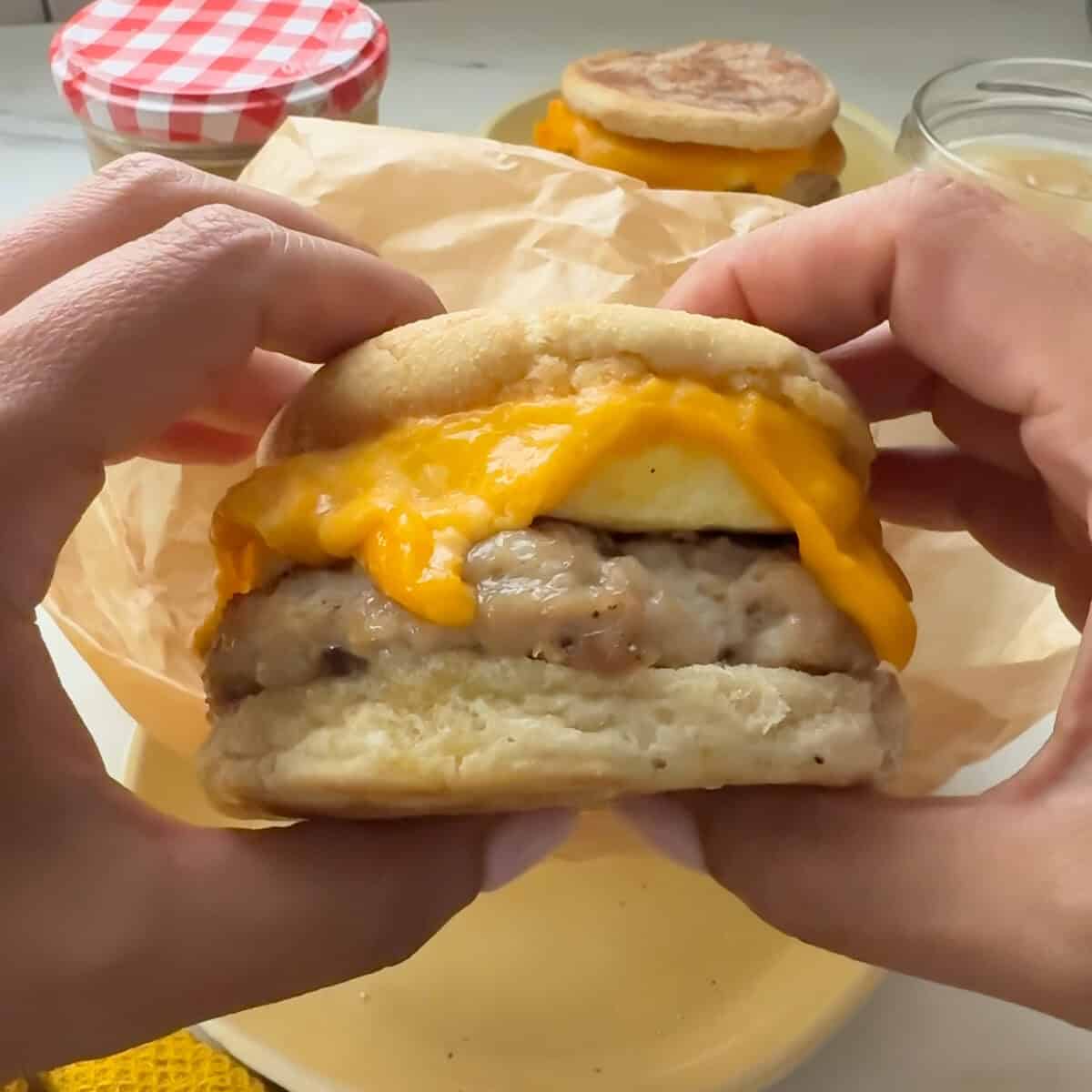 Freezer Breakfast Sandwich being held.