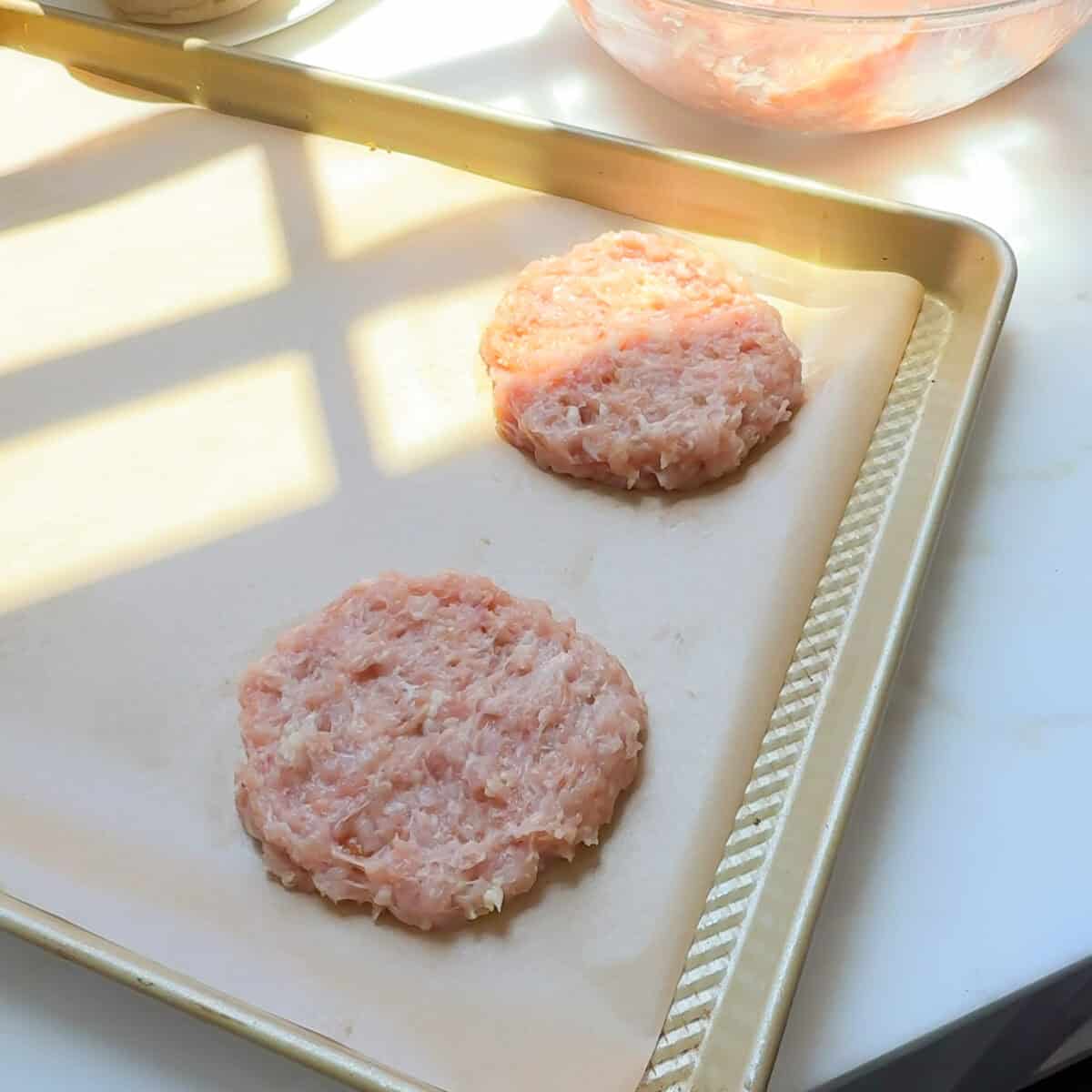 Chicken sausage patties being formed.