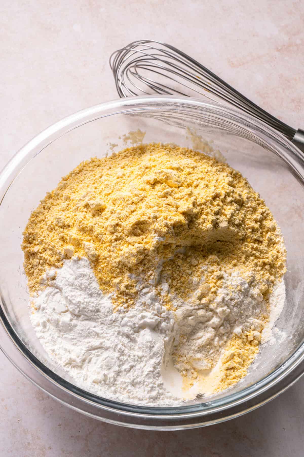 Honey cornbread muffins dry ingredients in a bowl.