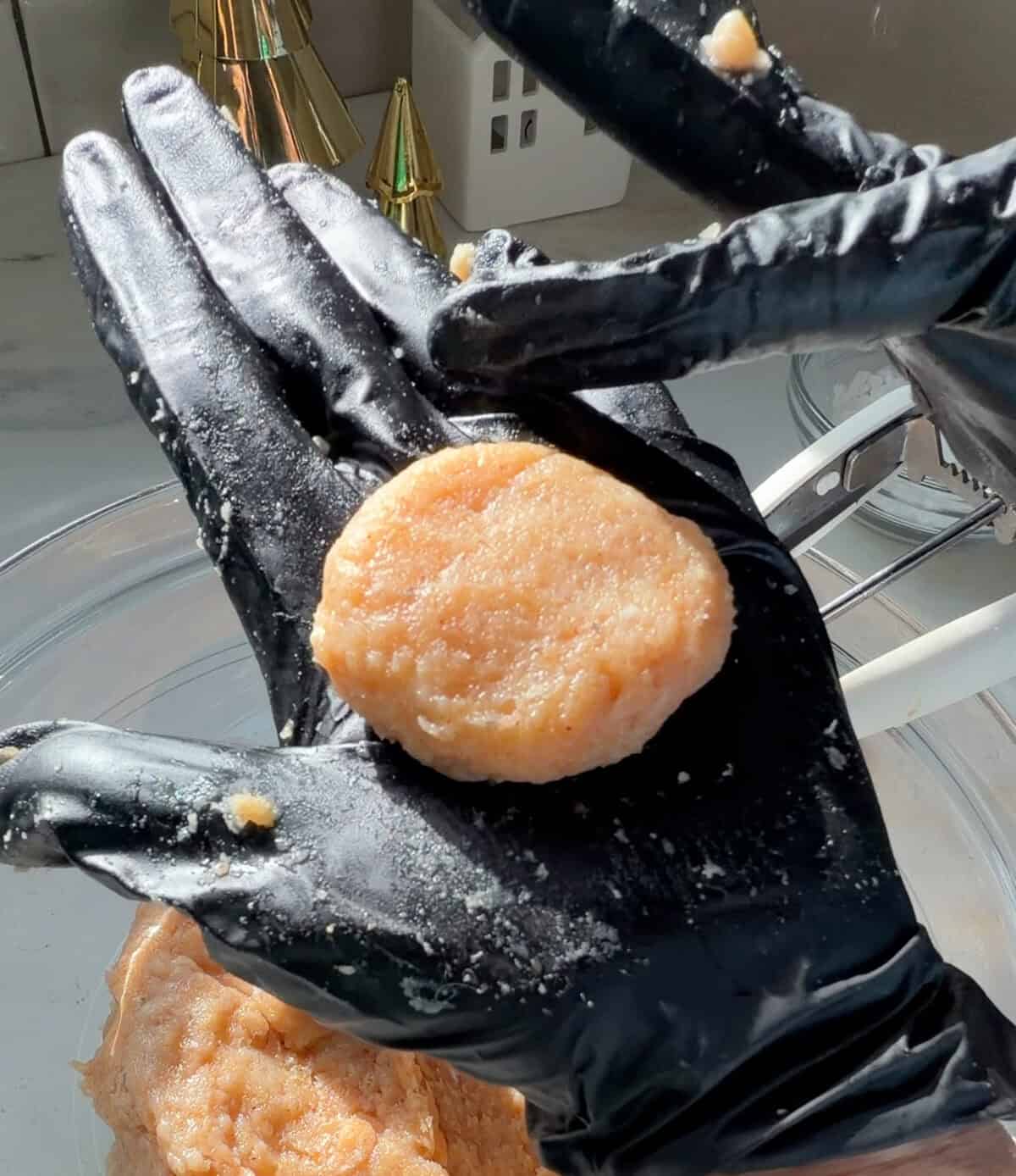 Ground chicken shaped into a chicken nugget.