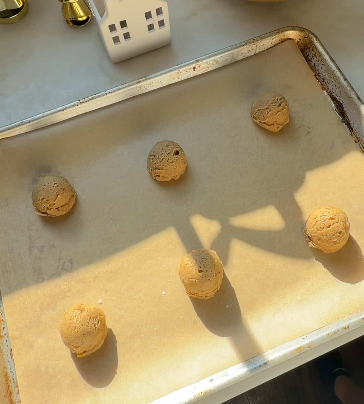 Tiramisu cookie dough on sheet tray.
