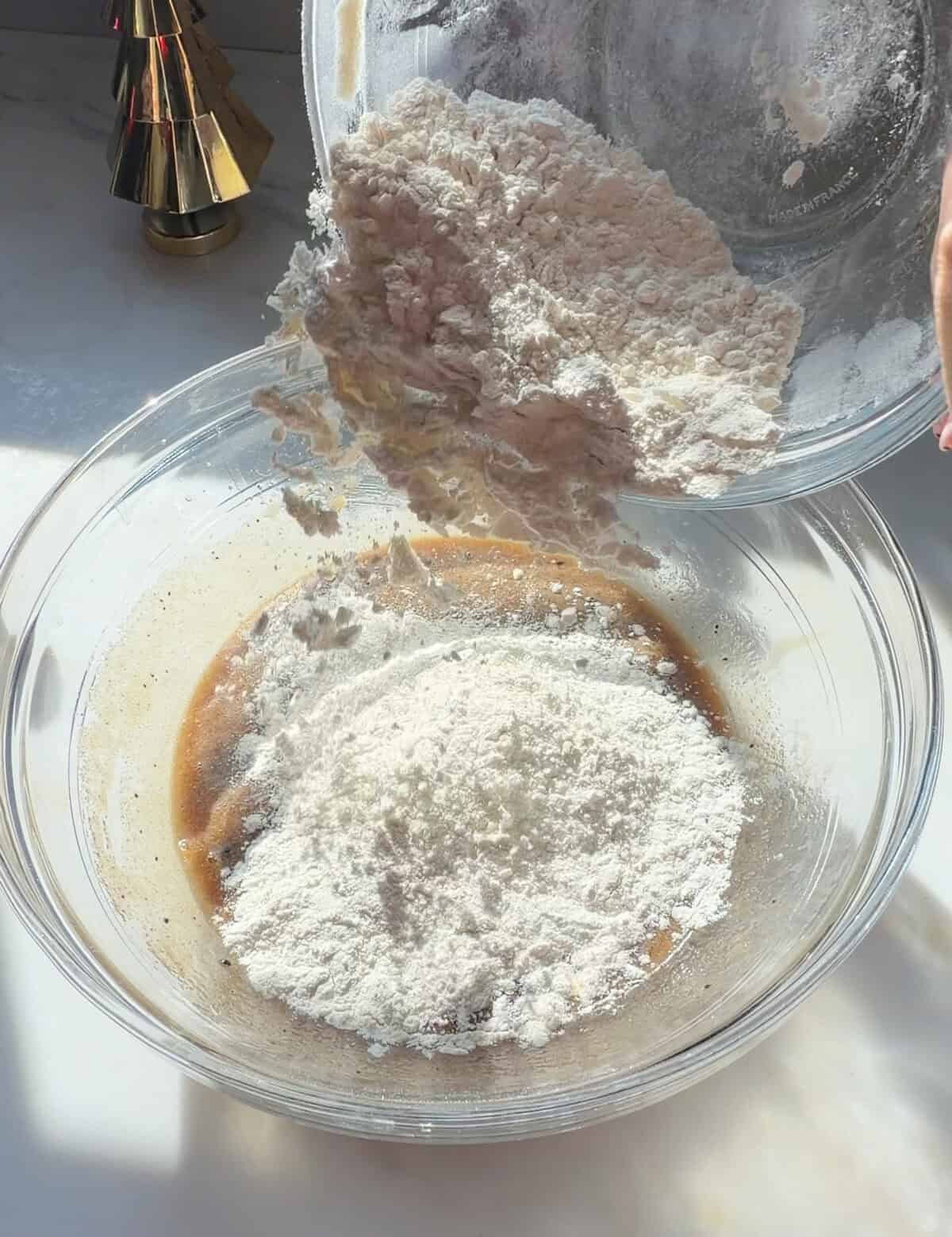 Tiramisu cookies dry ingredients added to wet ingredients.