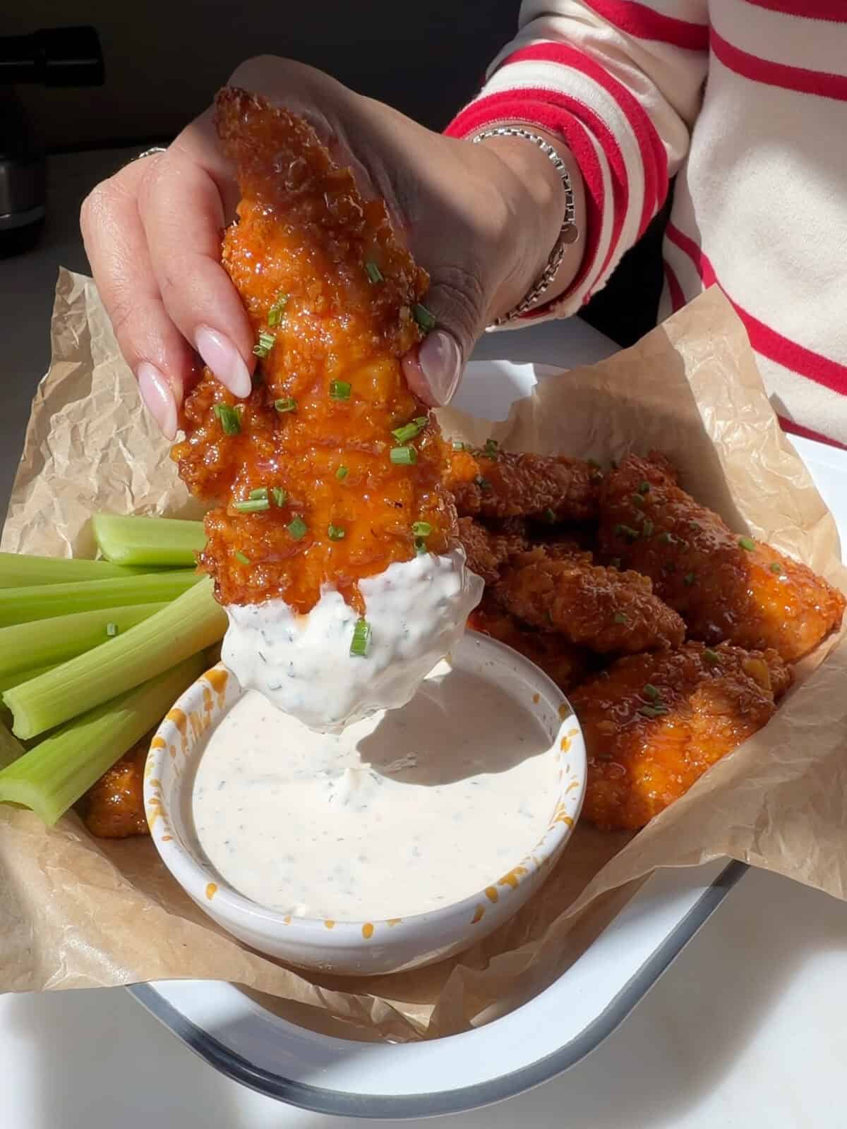 Hot Honey Buffalo Chicken Tenders dipped in buttermilk ranch.