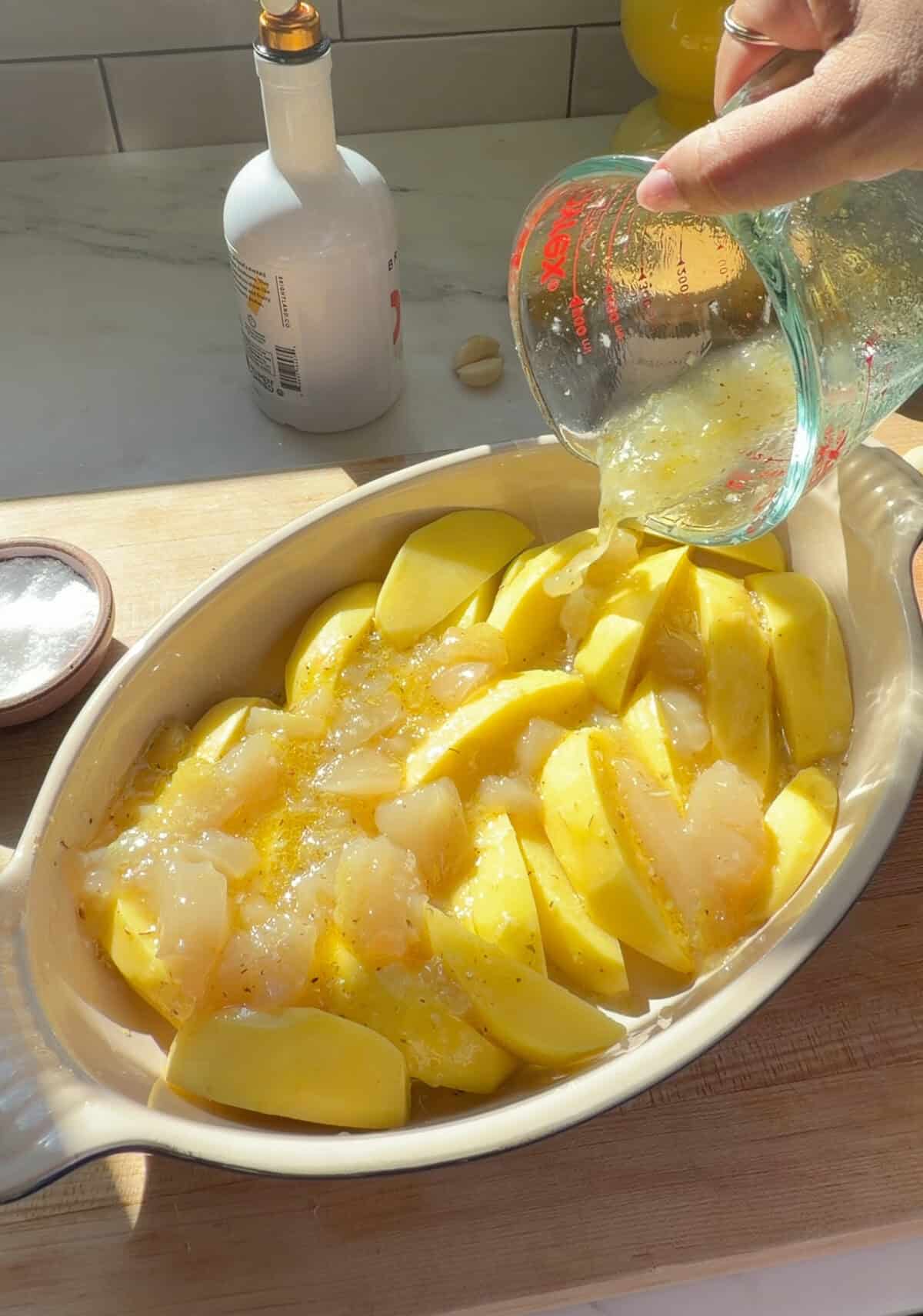 Broth poured over potatoes to make Greek Lemon Potatoes.