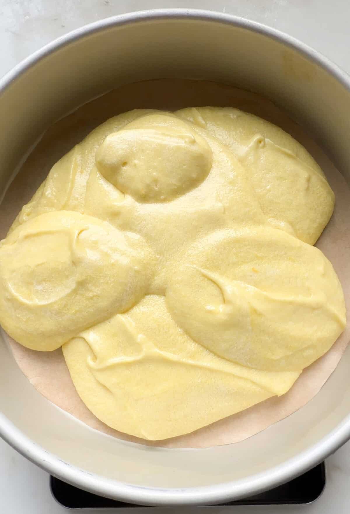 Batter in a cake pan.