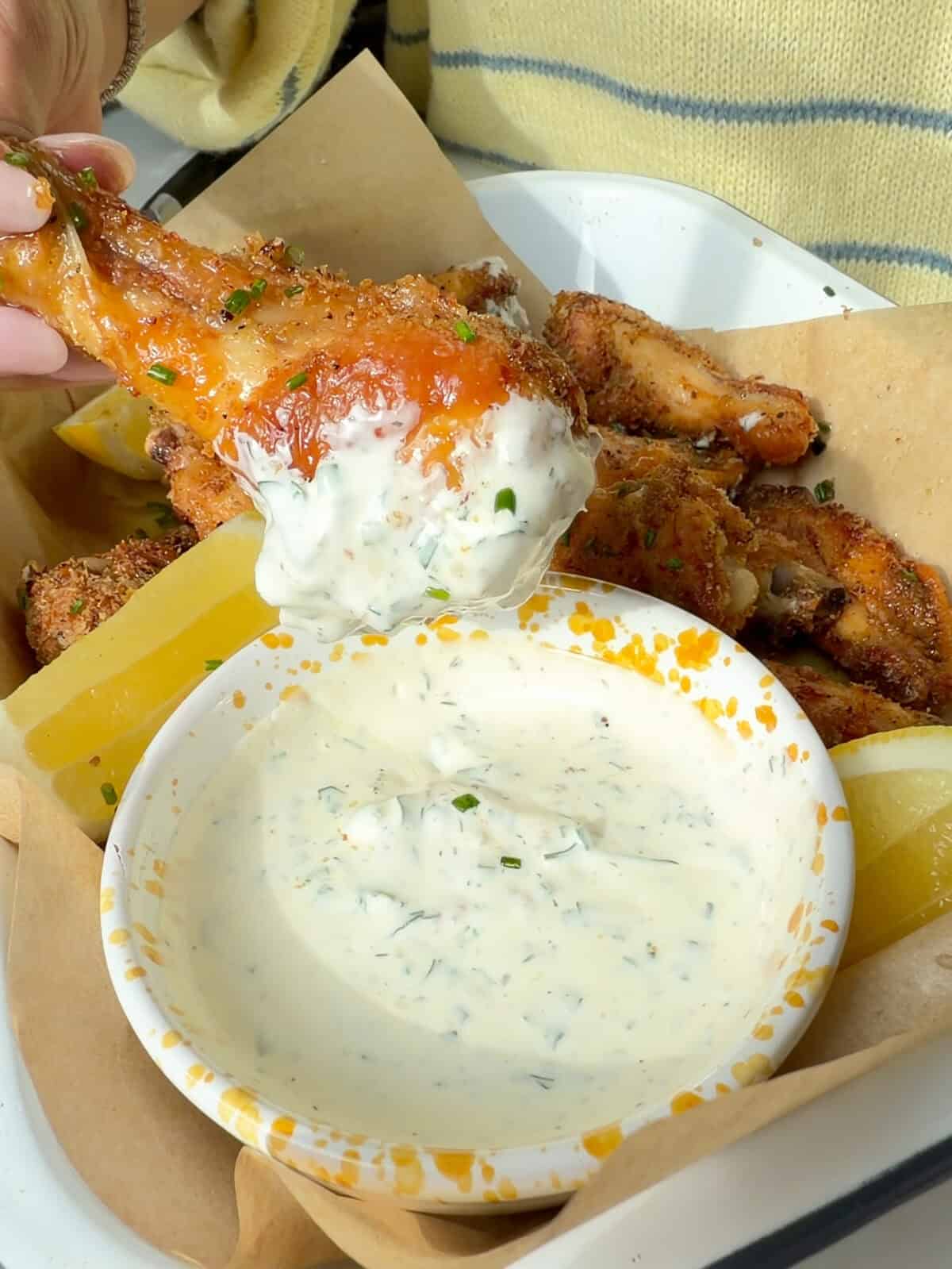 Crispy lemon pepper wings with buttermilk ranch.