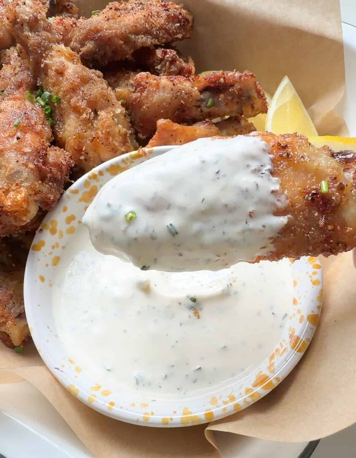 Crispy lemon pepper wings with buttermilk ranch.