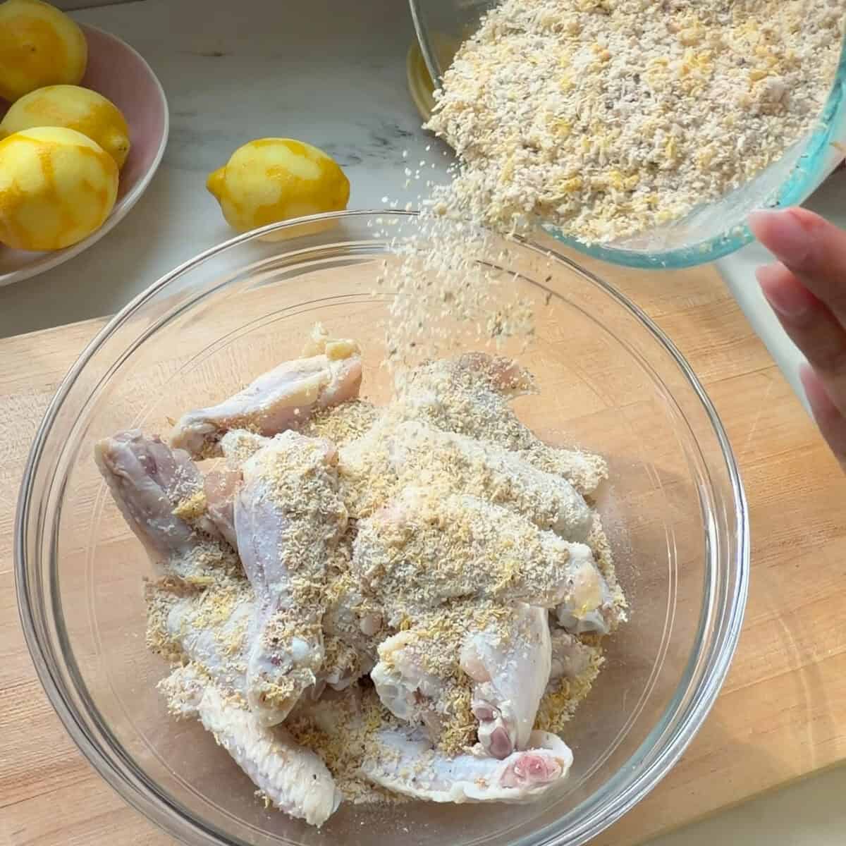 Lemon pepper seasoning on sprinkled on chicken wings.
