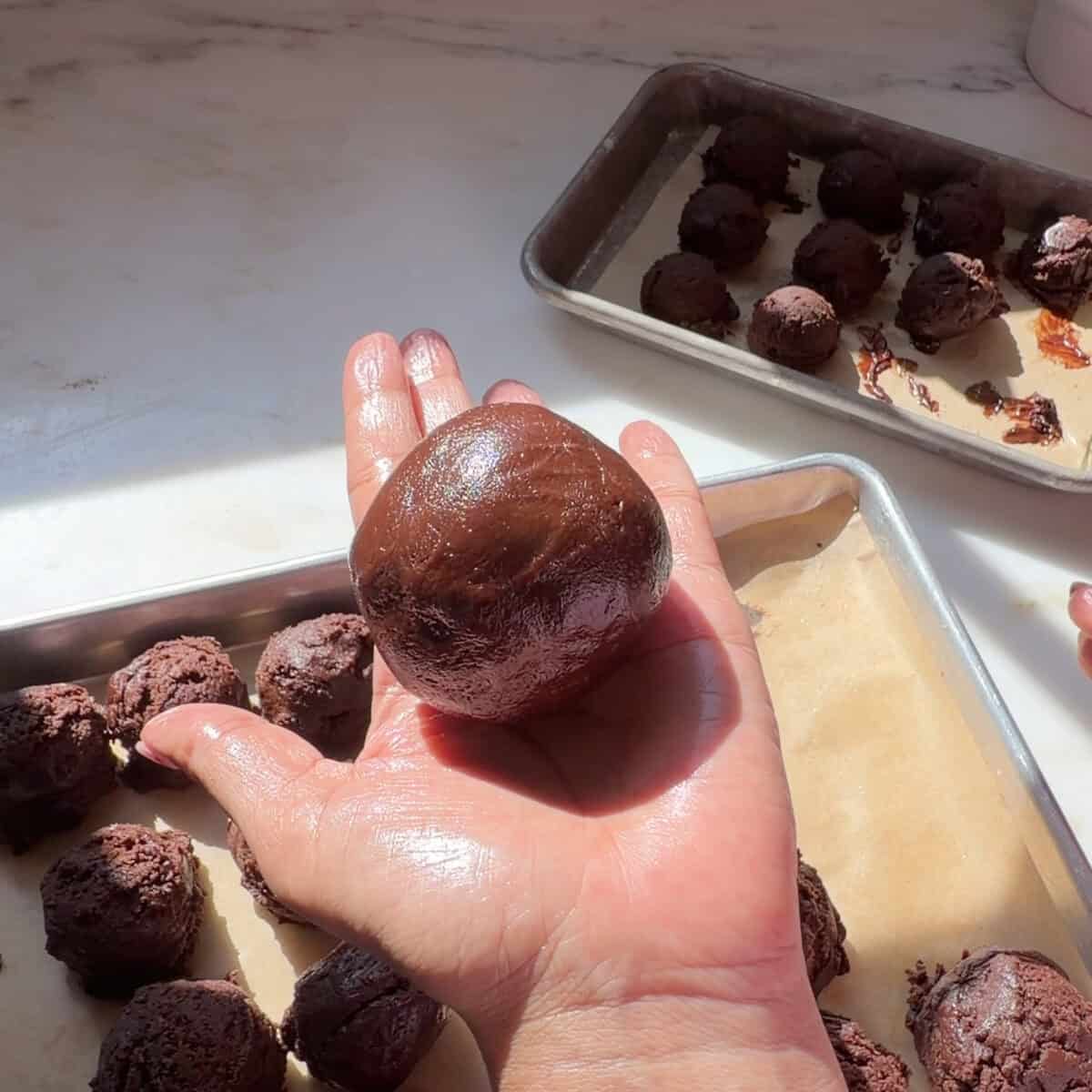 Assembled Brownie Pudding Cookie dough ball.