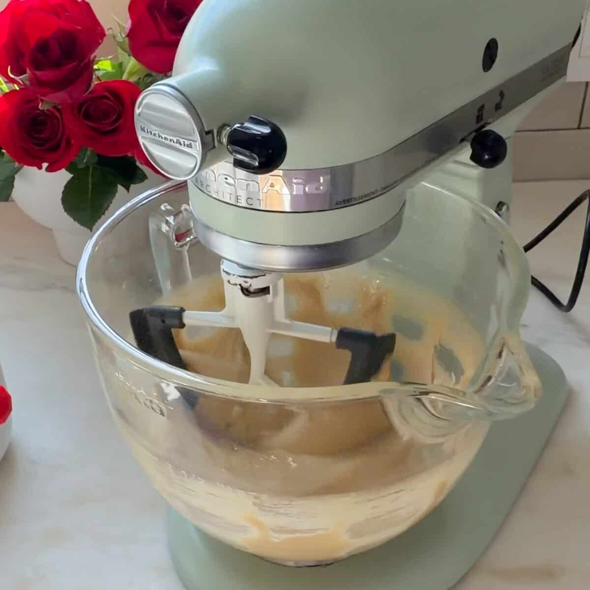 Whipping eggs and sugar in stand up mixer.