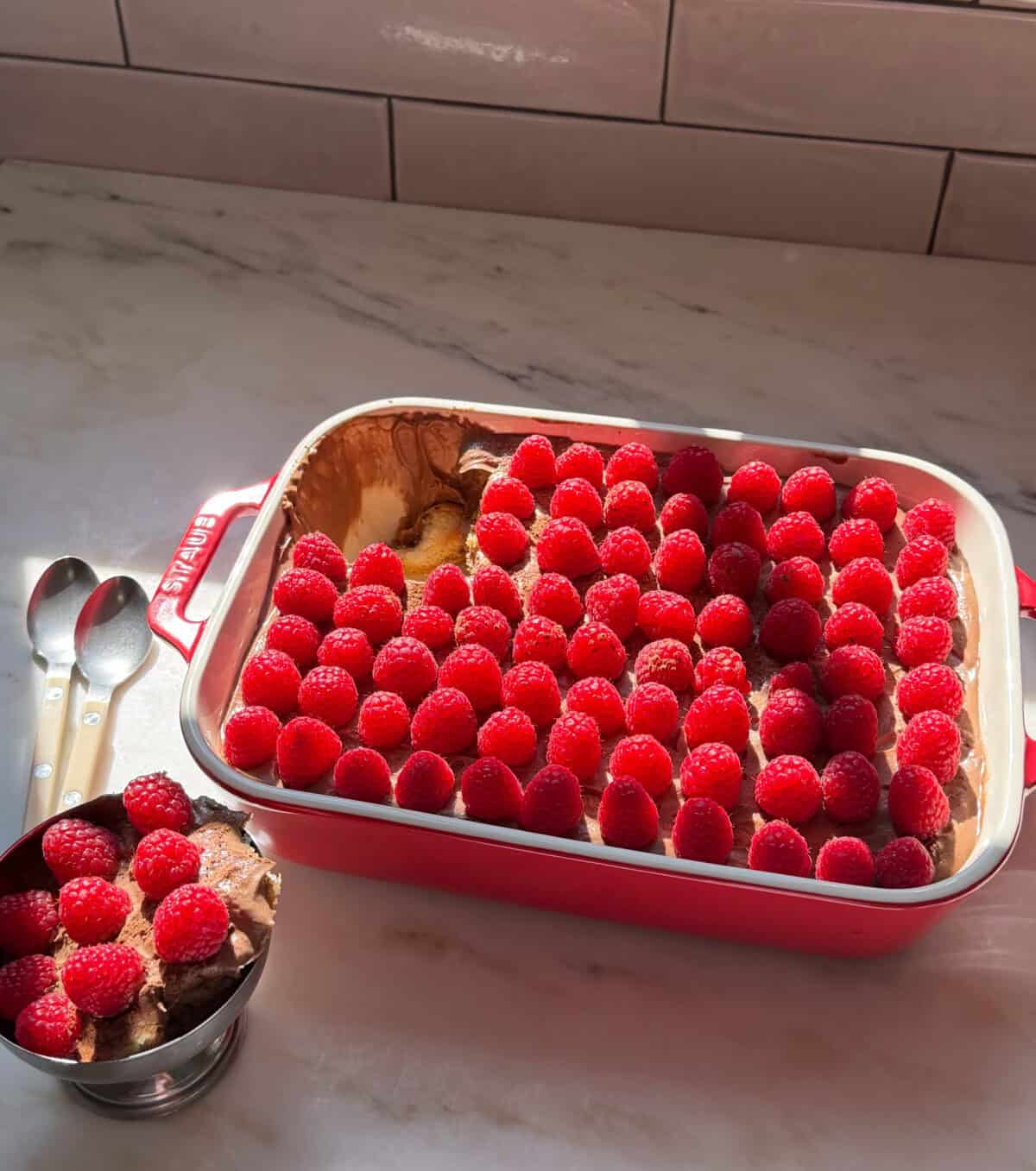 Chocolate Raspberry Tiramisu with a portion scooped into bowl.