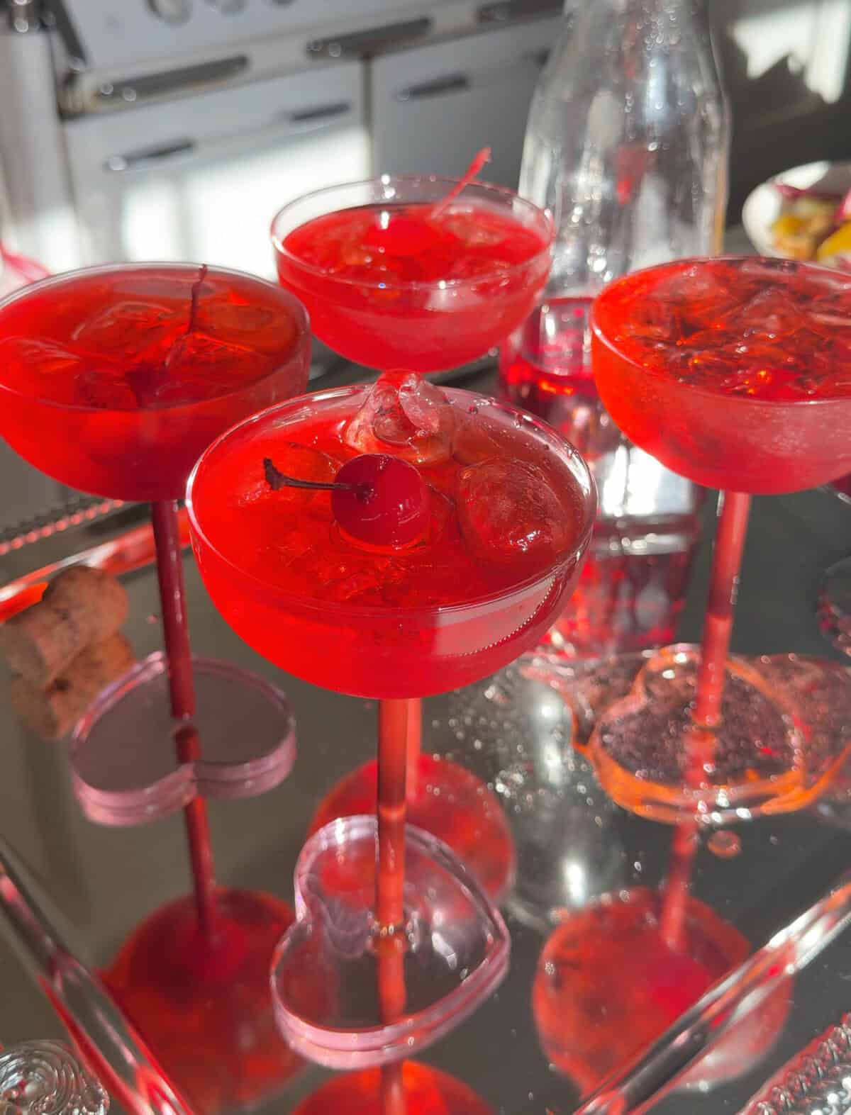 Four glasses of Dirty Shirley cocktail.