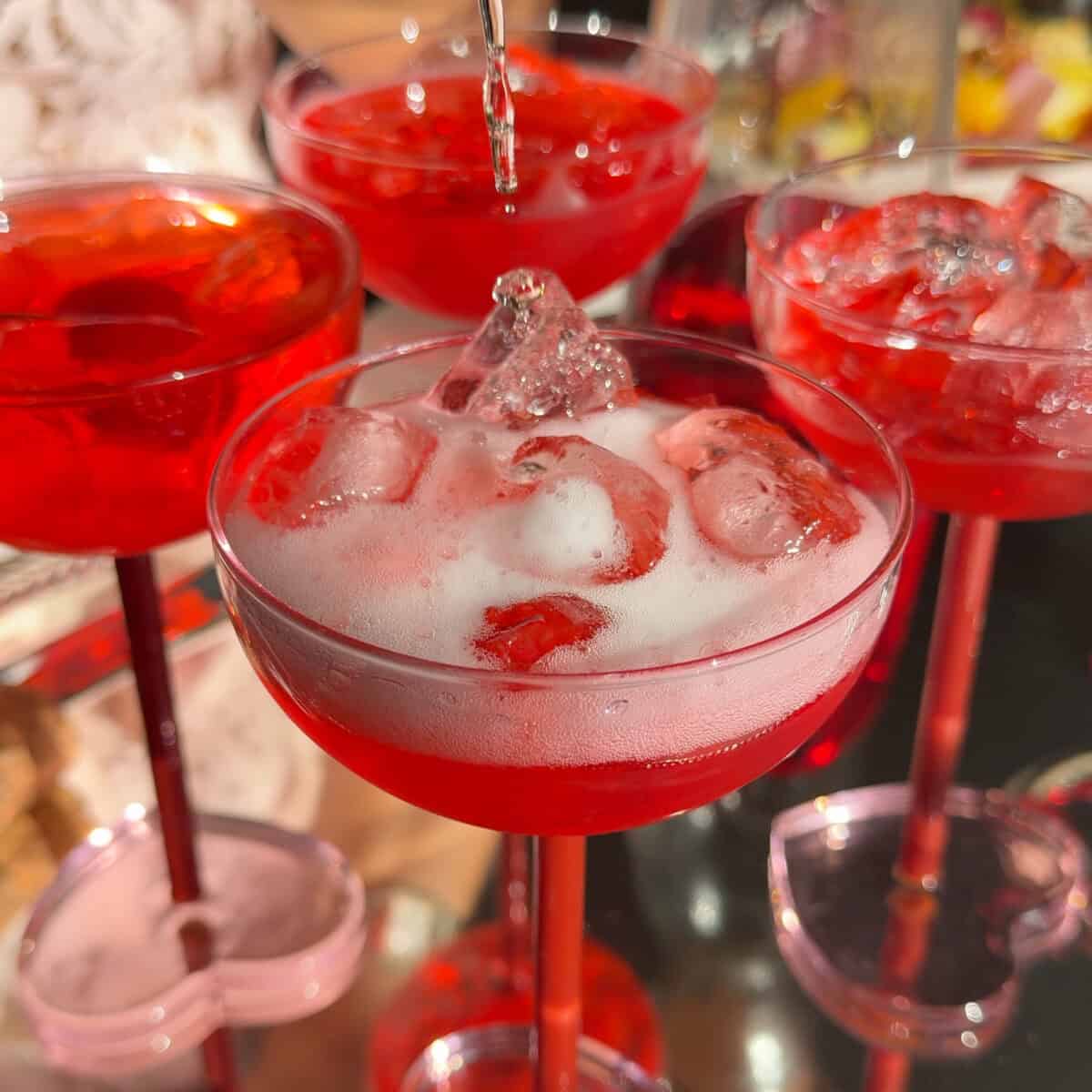 Pouring soda into glass.