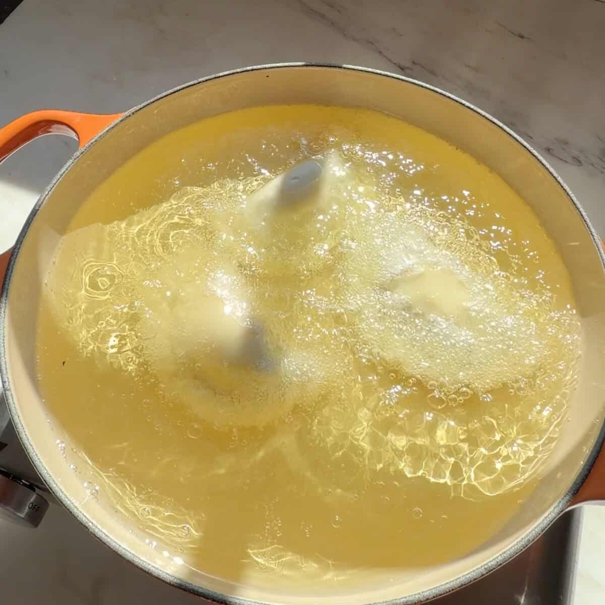 In-N-Out empanadas frying in oil.