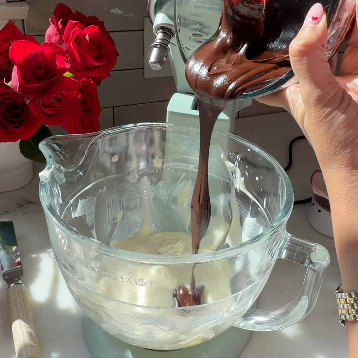 Adding ganache to mascarpone and sugar mixture.