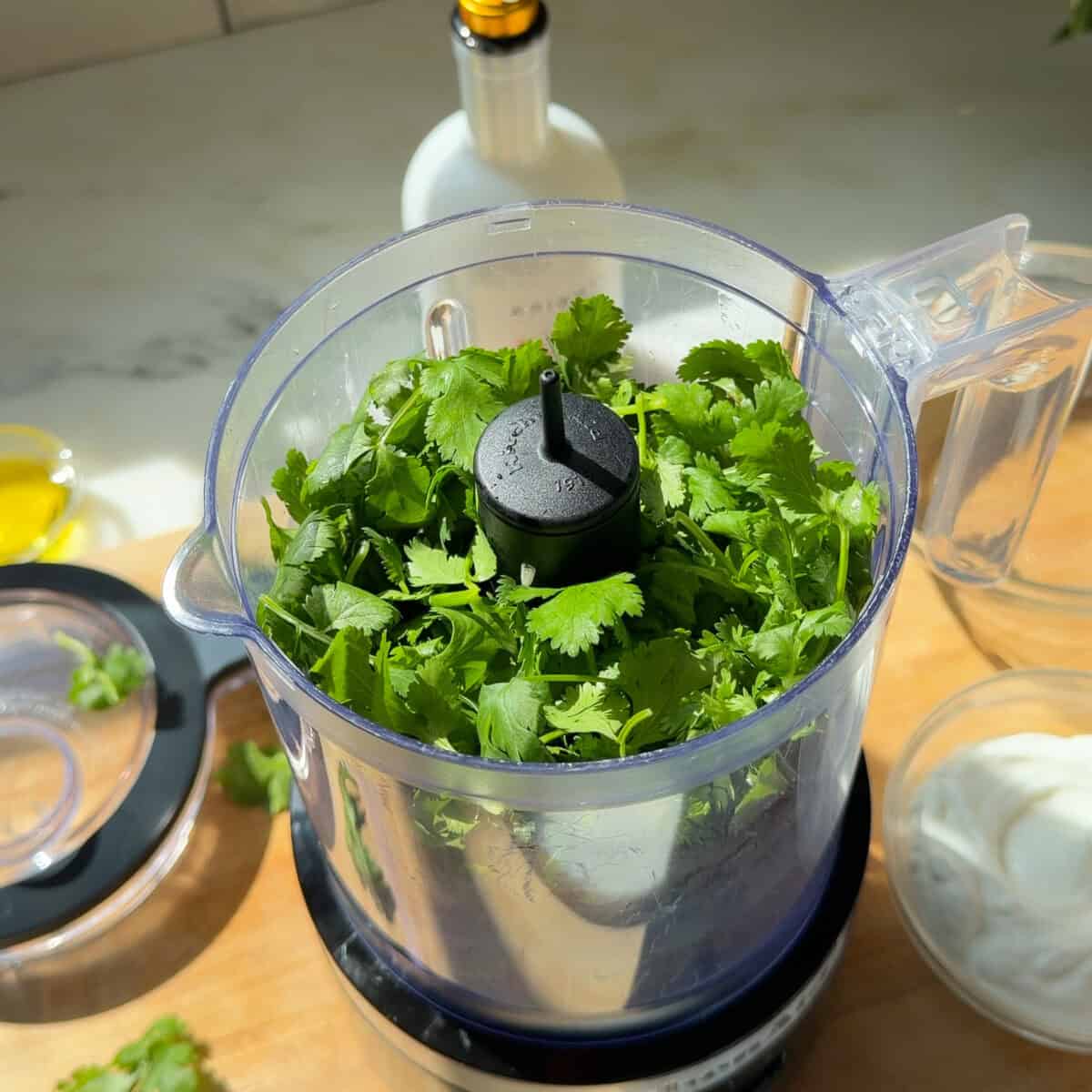 Fresh herbs in food processor.