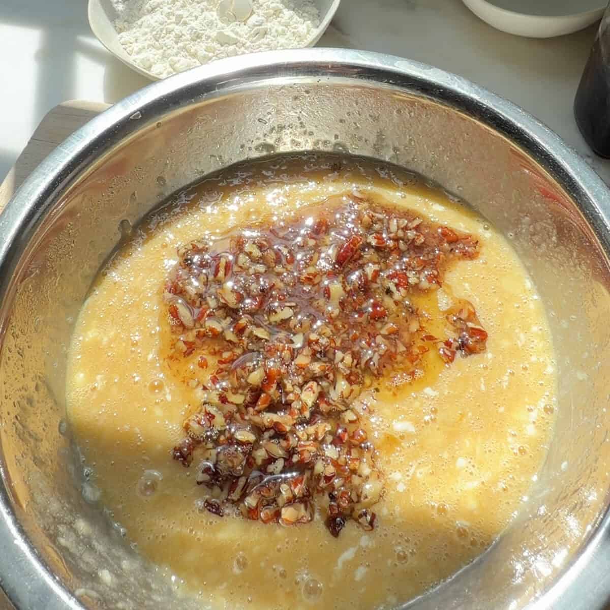 Butter Pecan Banana Bread wet ingredients with butter pecan mixture.