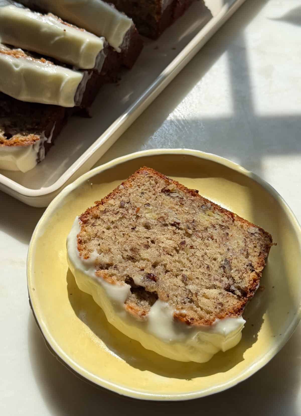 Slice of Butter Pecan Banana Bread on plate.