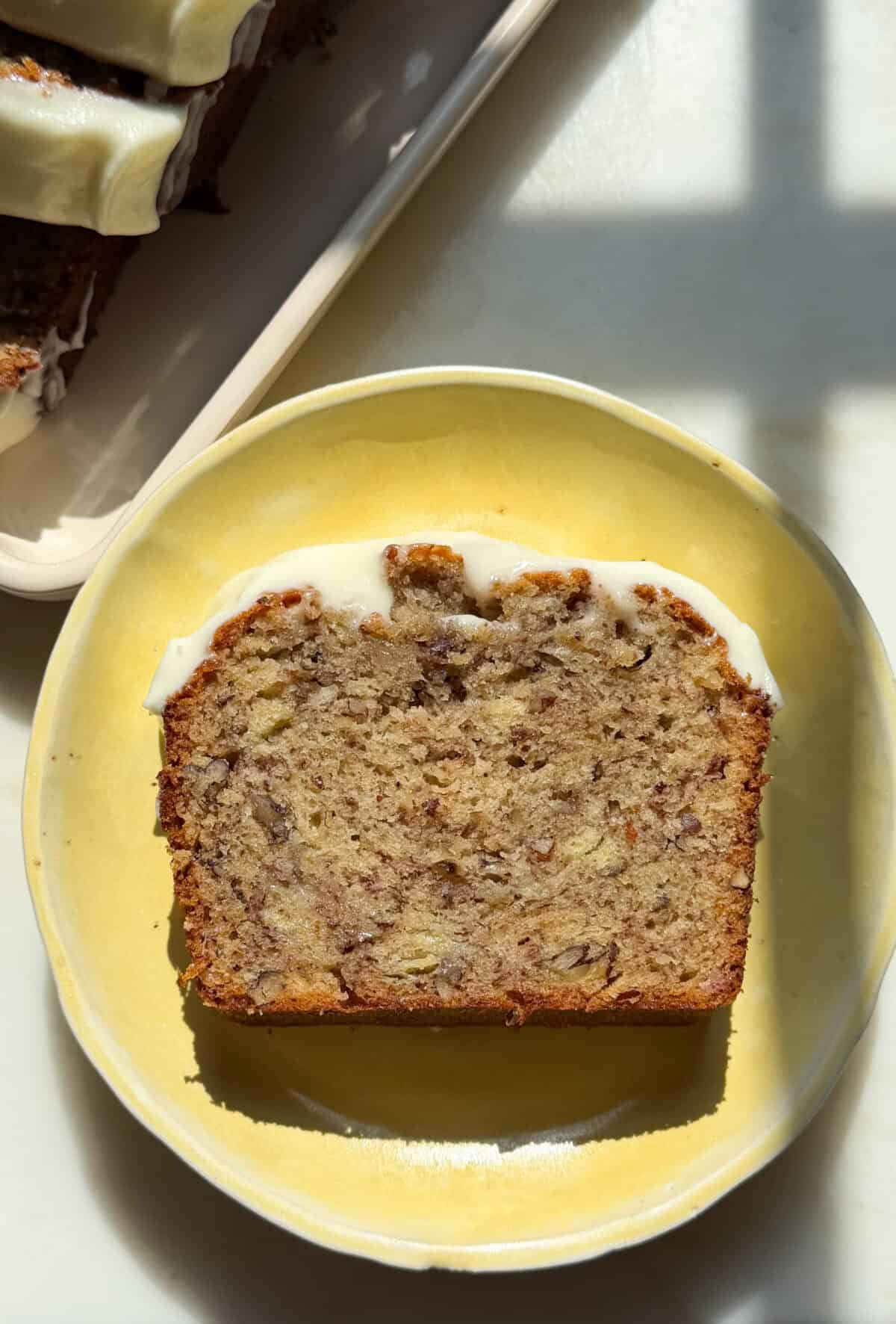 Slice of Butter Pecan Banana Bread on plate.