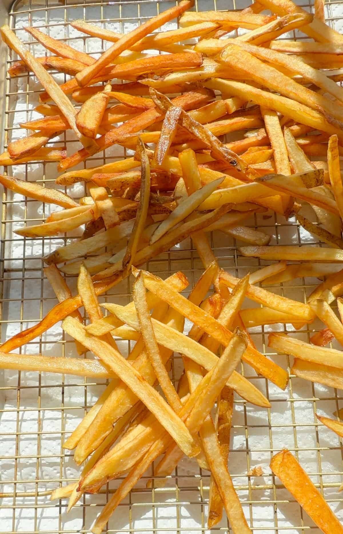 Crispy French Fries on baking sheet.