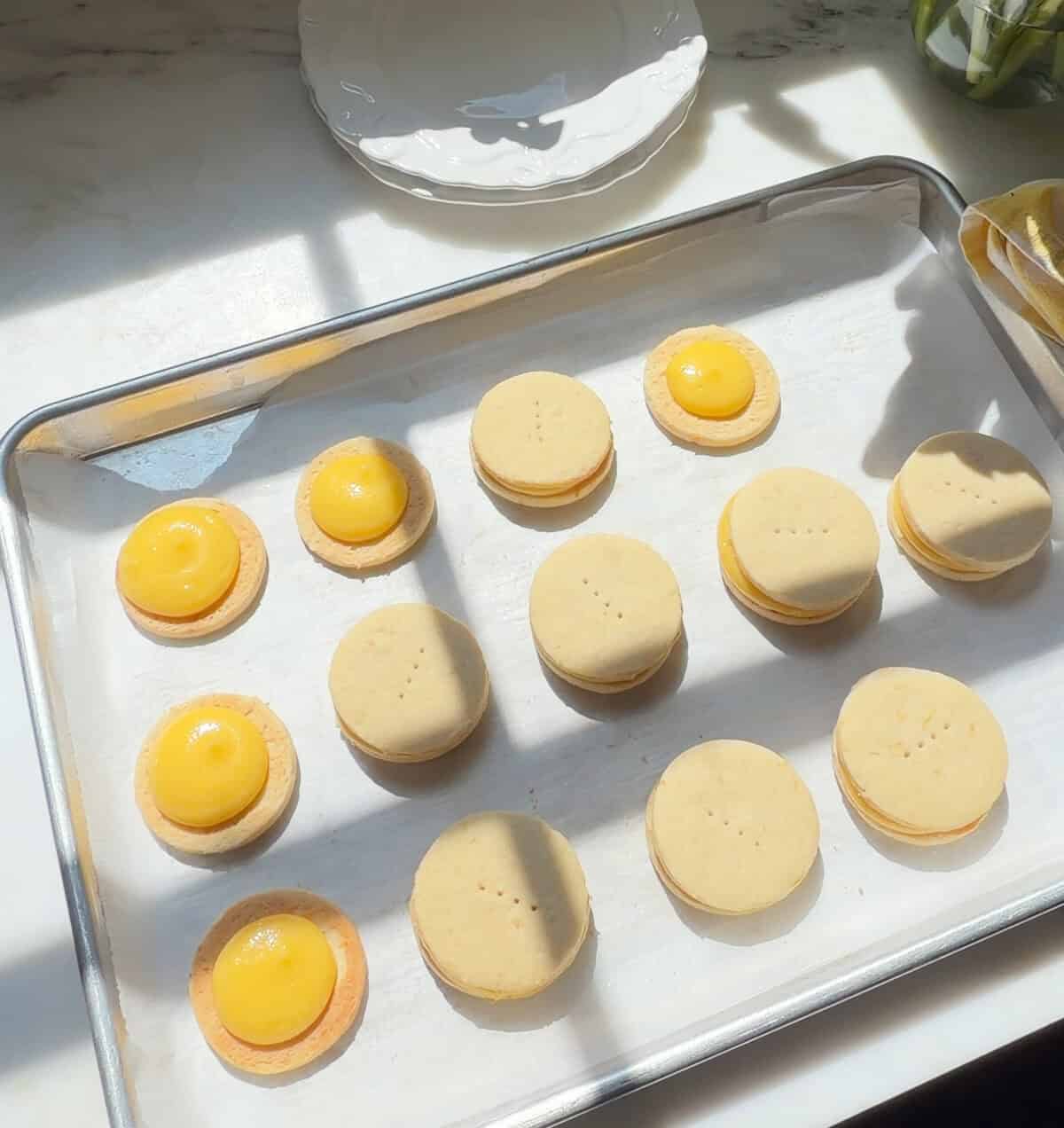 Lemon Alfajores on sheet tray.