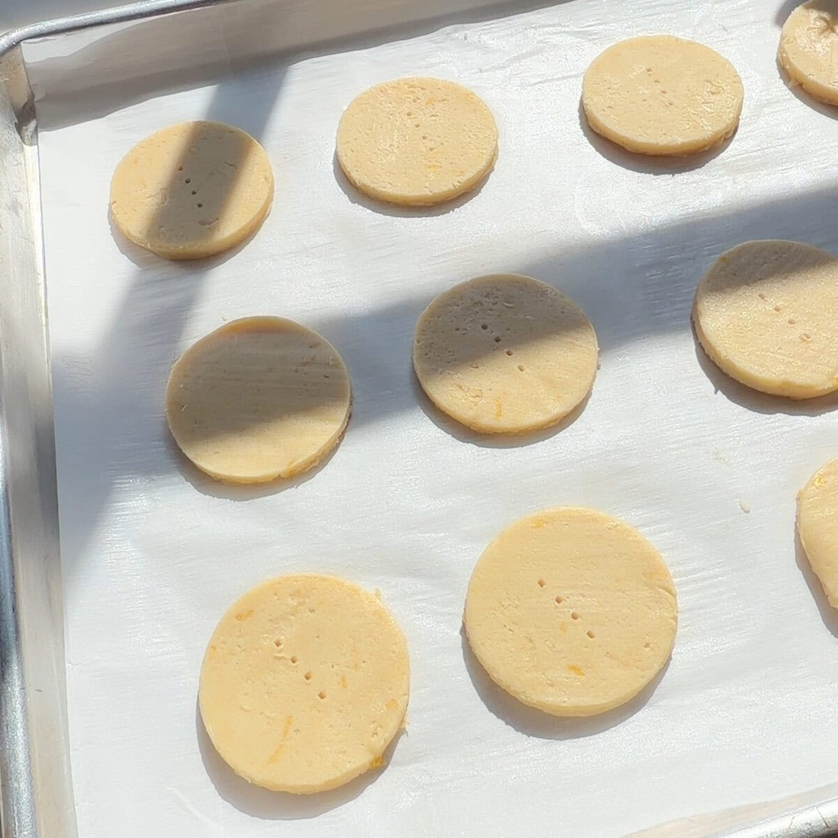 Raw cookies on sheet tray.