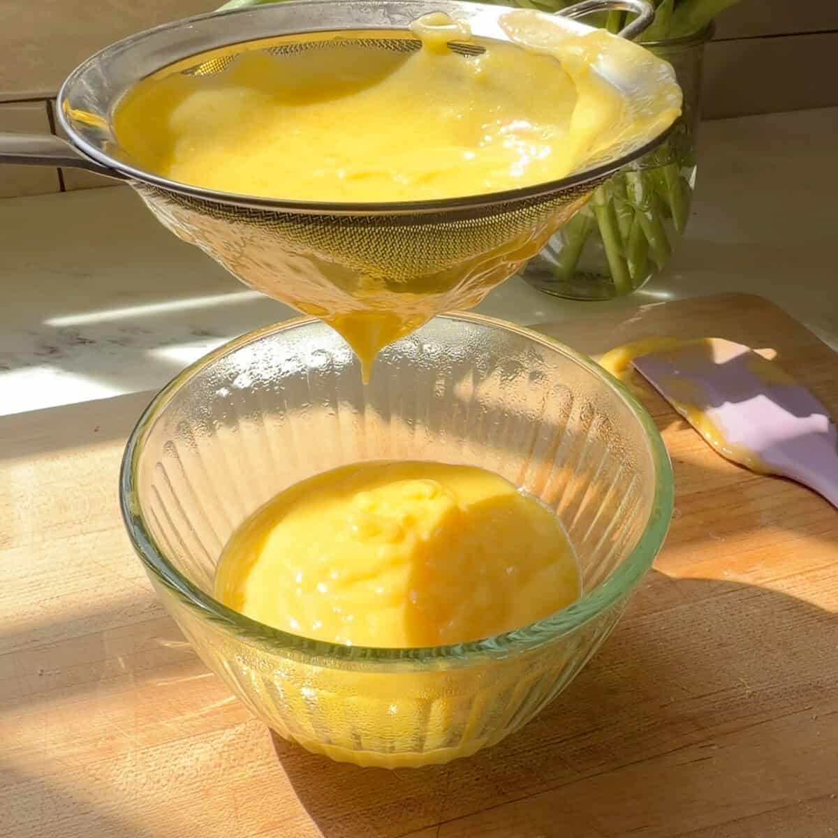 Straining lemon curd.