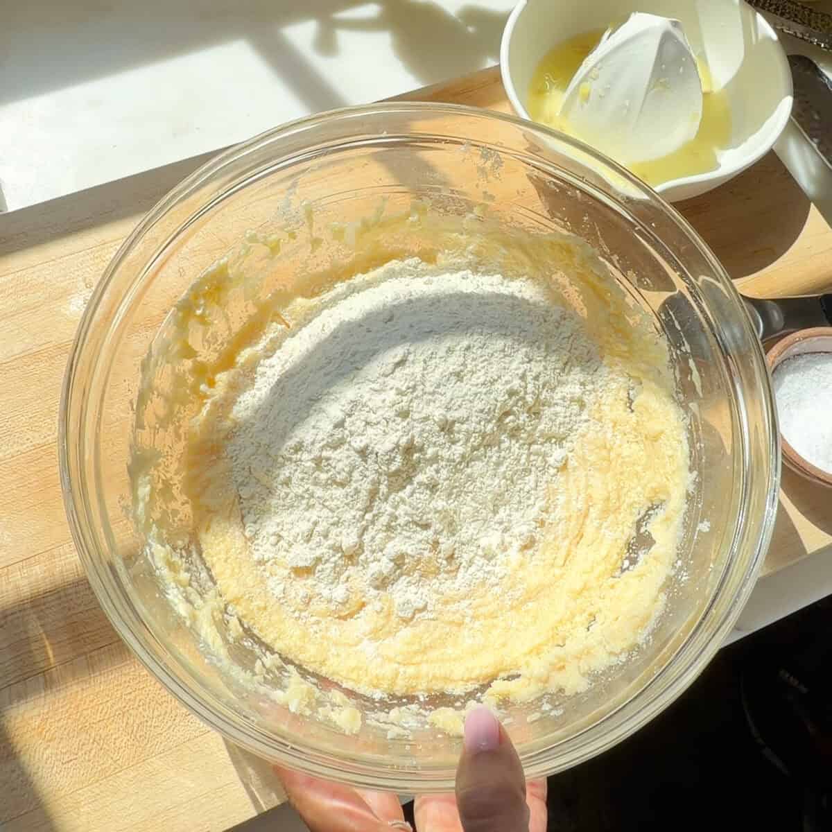 Dry ingredients on top of wet batter in bowl.