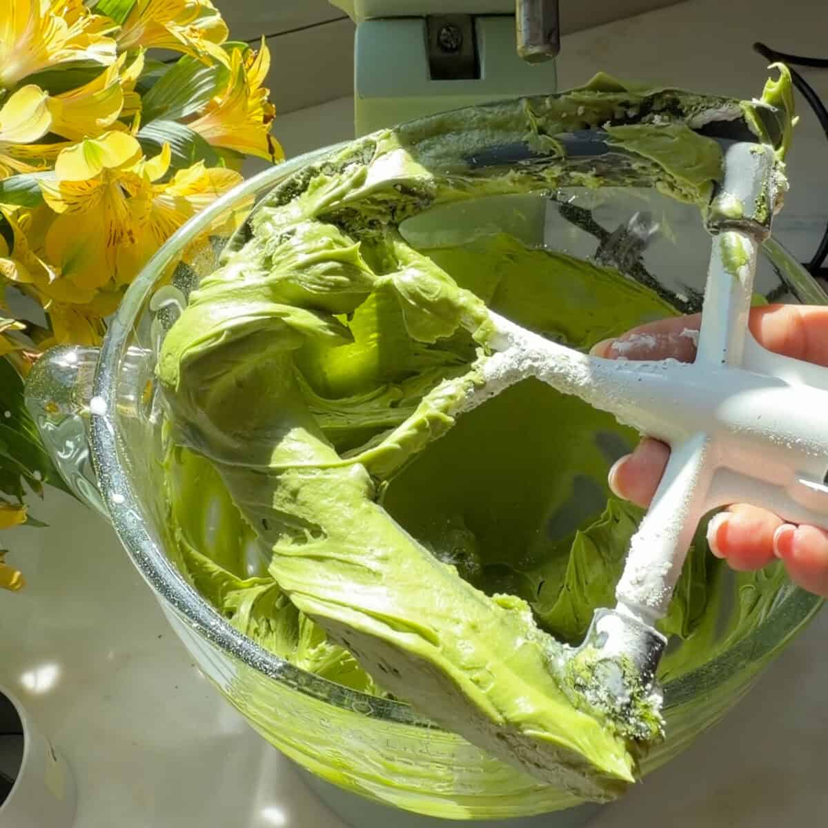 Matcha frosting on mixer paddle.