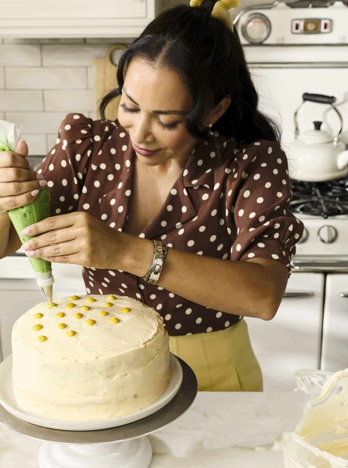 Adrianna decorating hummingbird cake.