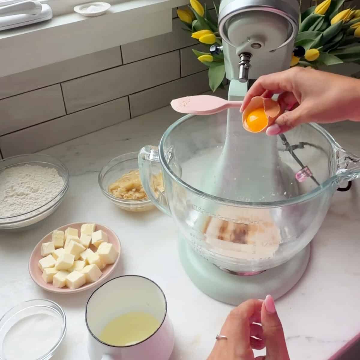 Adding egg yolk to yeast mixture.