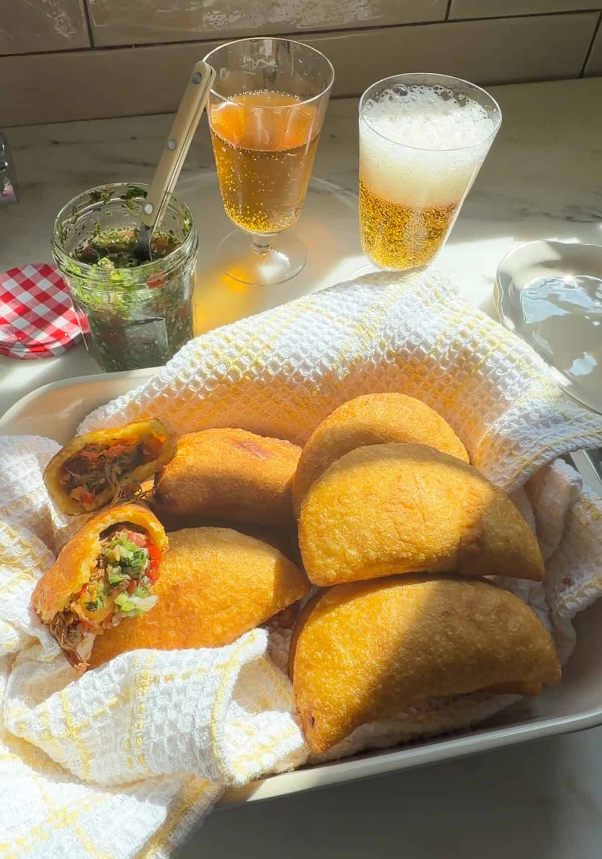 Fresh fried empanadas with aji picante.