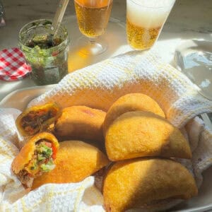 Fresh fried empanadas with aji picante.