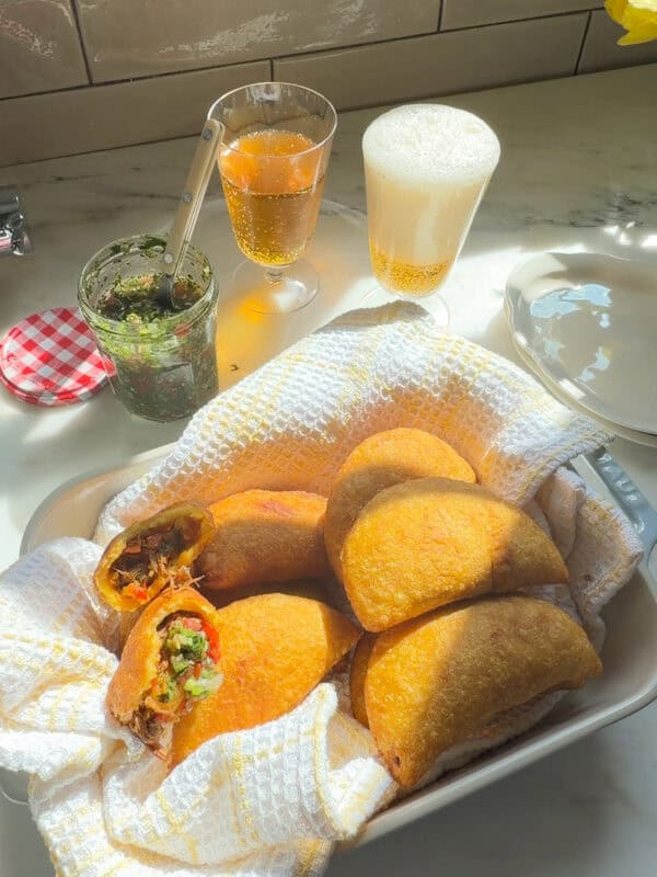 Fresh fried empanadas with aji picante.