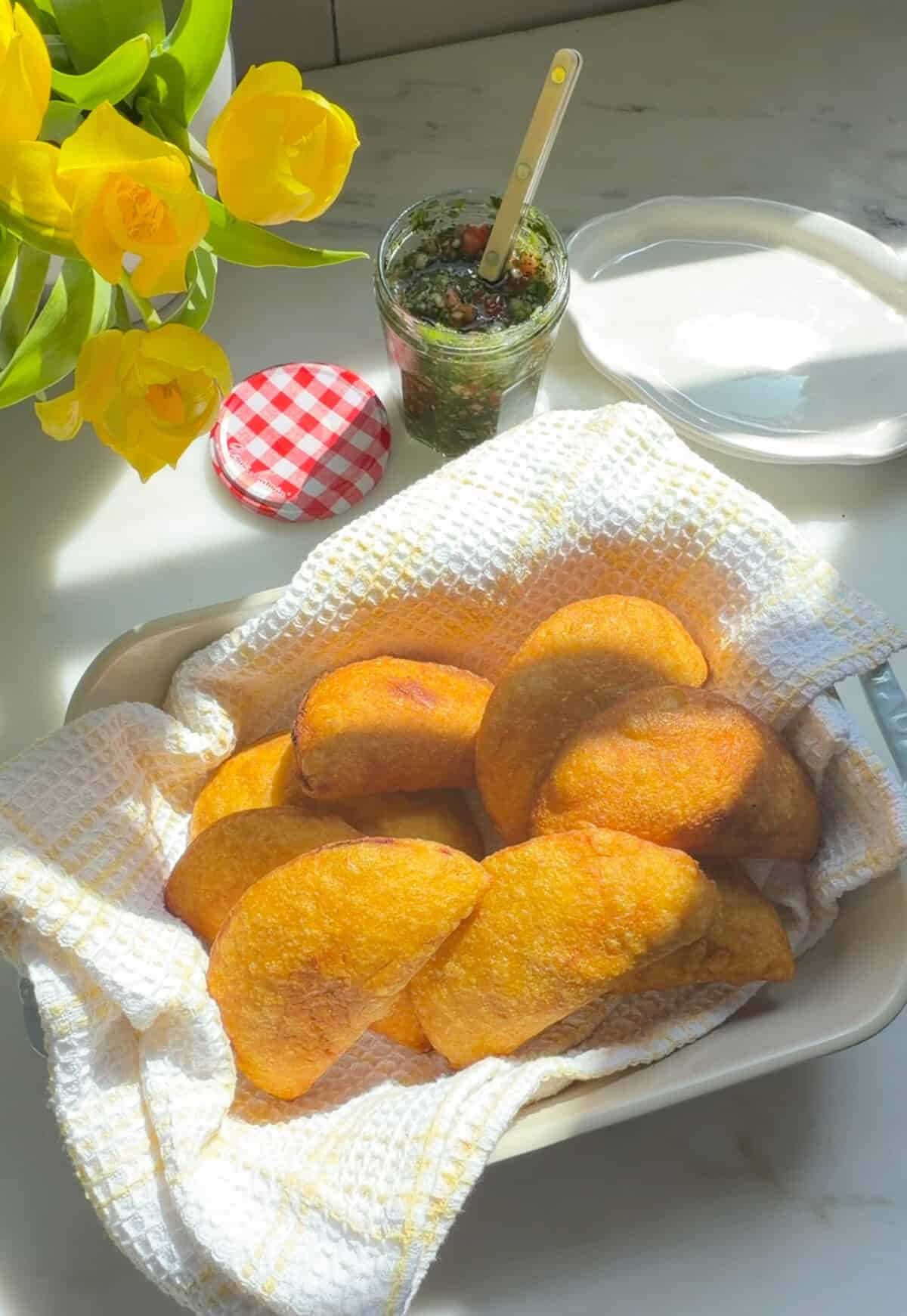 Fresh fried empanadas with aji picante.