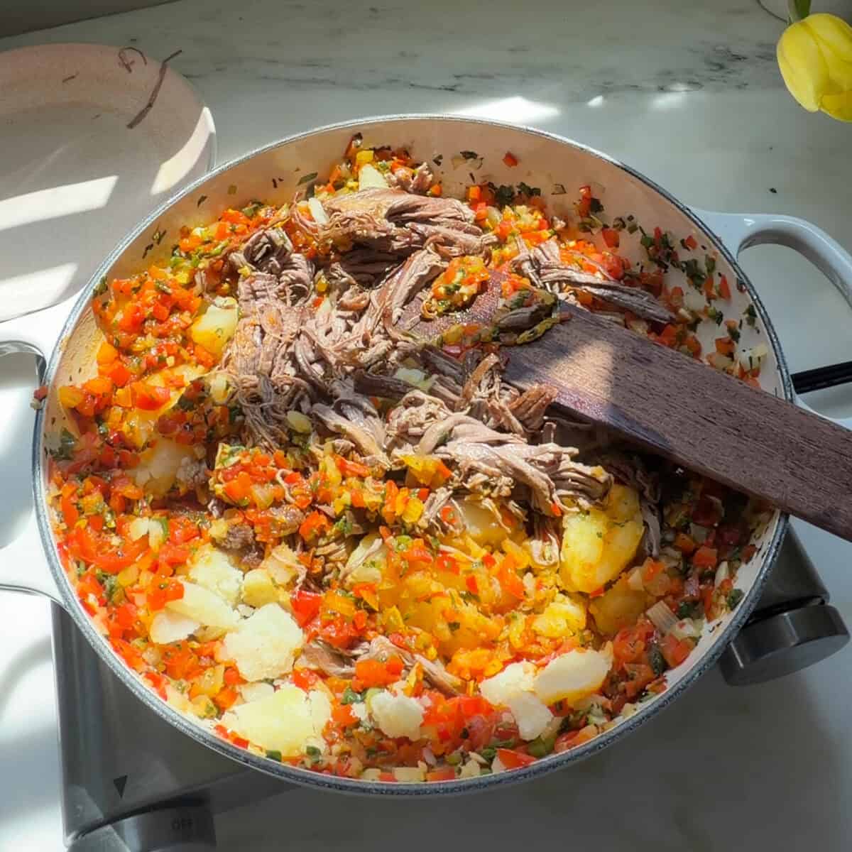 Empanada filling in large skillet.
