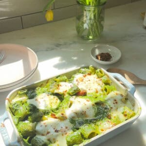 Pesto Pasta Bake in a baking pan fresh out of the oven.