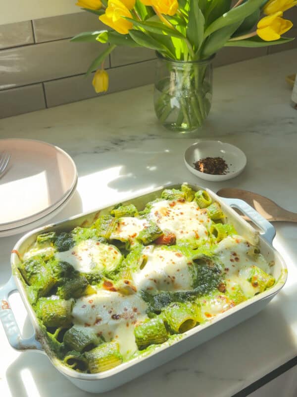 Pesto Pasta Bake in a baking pan fresh out of the oven.