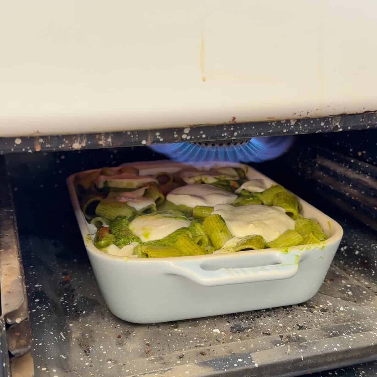 Pesto Pasta Bake under the broiler.