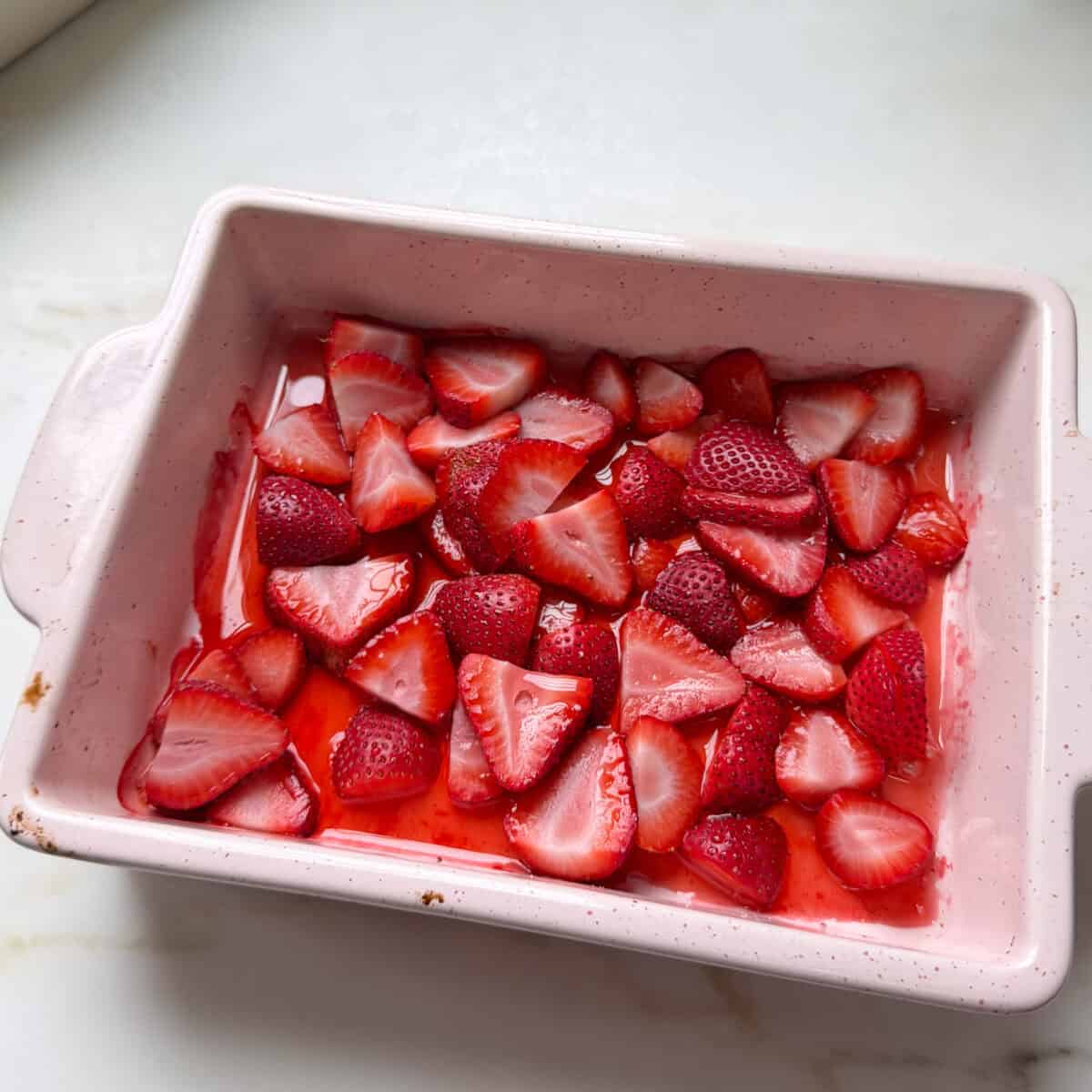 Gently roast strawberries in baking dish.